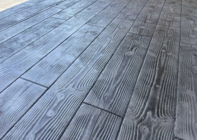 JP Custom Concrete installs beautiful stamped concrete patios with wooden deck patterns