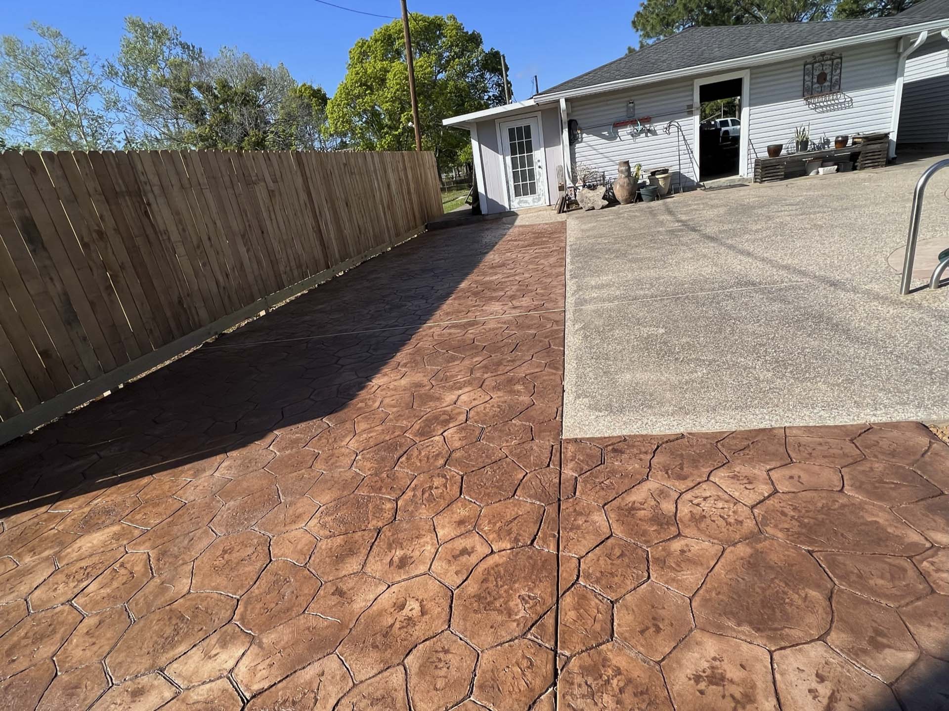 Extended patio and pool deck by stamped concrete experts at JP Custom Concrete in Friendswood, TX