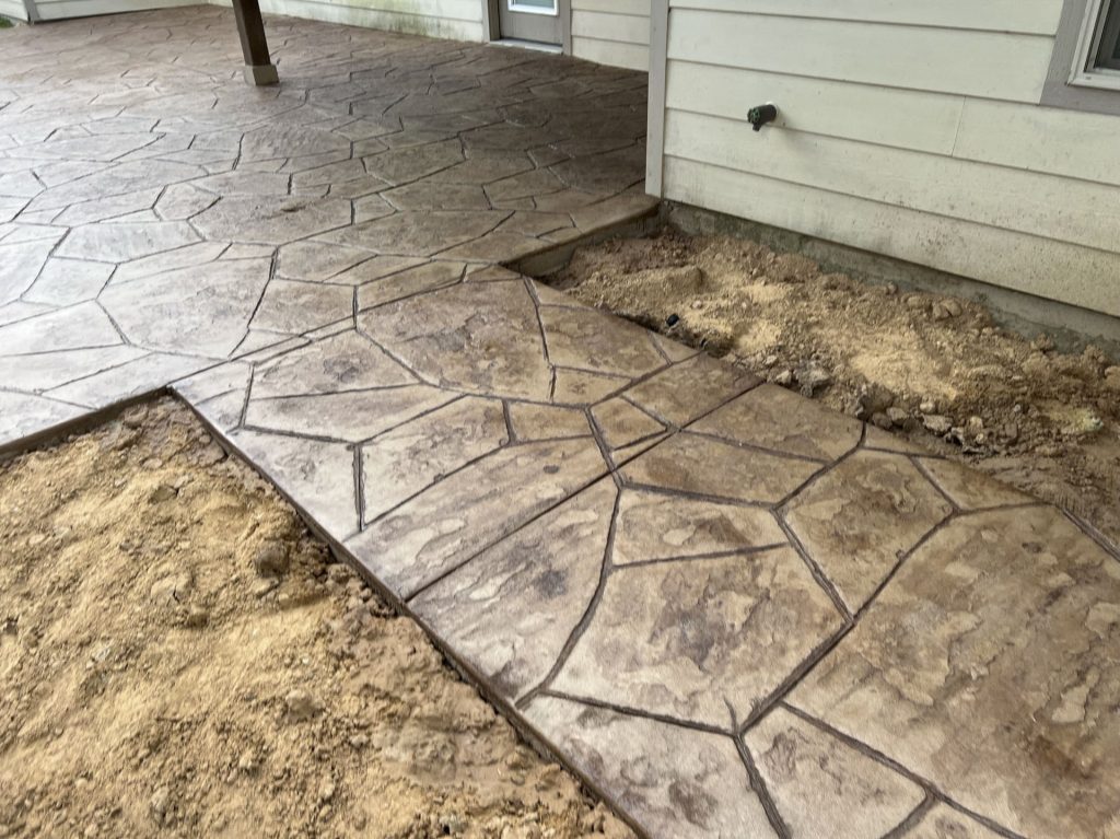 Stamped concrete sidewalk and patio installed by JP Custom Concrete in south Houston