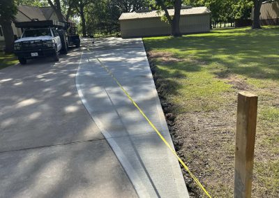 Concrete driveway contractors installing new parking extension in Friendswood, TX