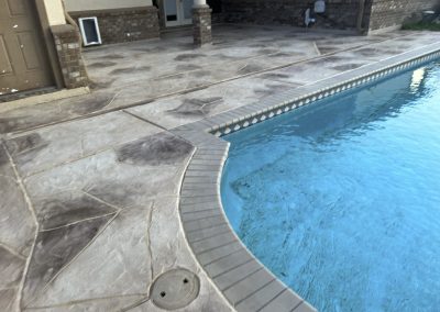 Stamped concrete pool deck built by expert concrete contractors in Friendswood, TX