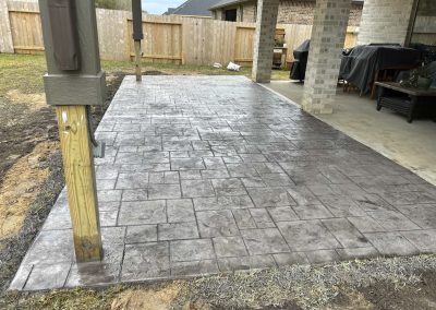 Stamped concrete patio extension for existing backyard patio installed by JP Custom Concrete