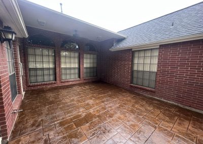 Stamped, stained and sealed custom concrete patio installed by expert concrete contractors at JP Custom Concrete serving south Houston communities