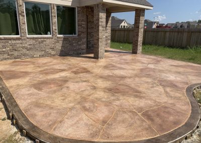 Custom stamped concrete patio by expert concrete contractors at JP Custom Concrete in Friendswood, TX